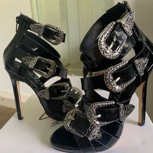 Black strap buckle heels